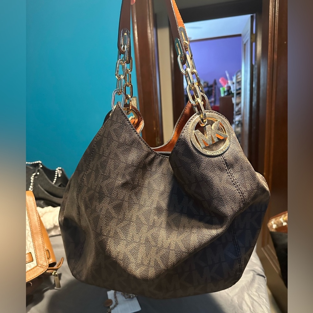 Michael Kors Fulton hobo bag in the brown signature monogram coated canvas.